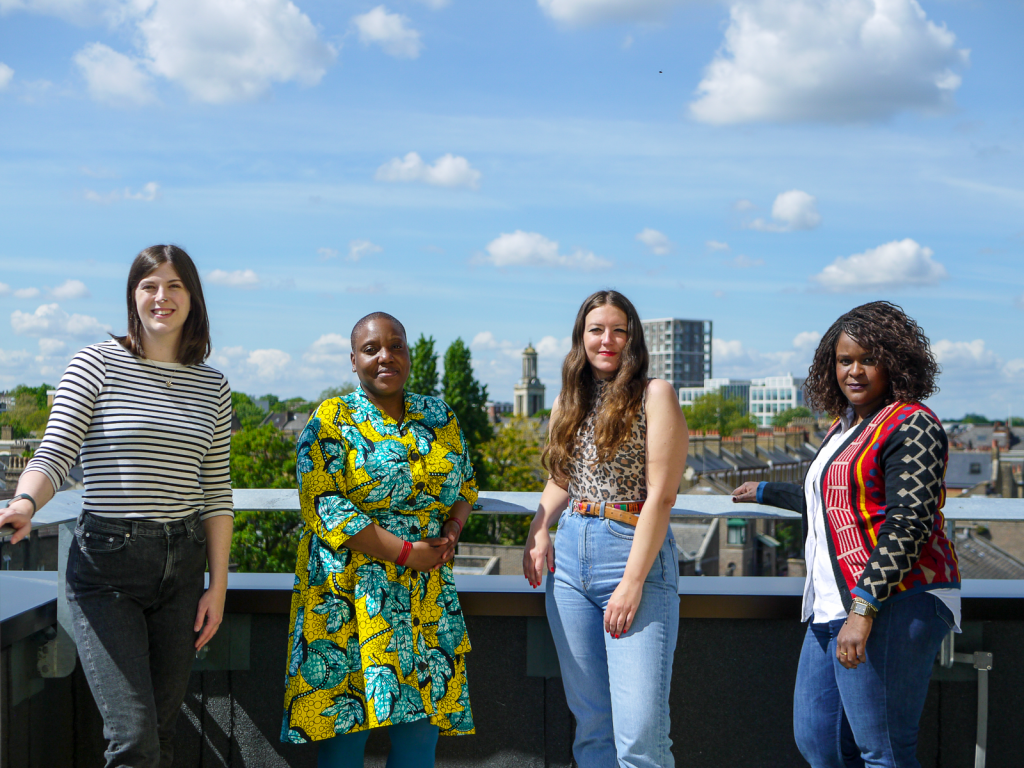 Four members of the Brixton House team stood on the roof of Brixton House.